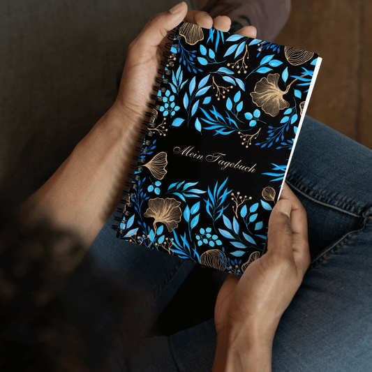 A person holding Blue Flower Garden Design Spiral Notebook, 140 pages